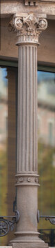Elements of architectural decorations of buildings, columns and tops, gypsum molding, wall texture and stucco patterns. On the streets in Barcelona, public places.