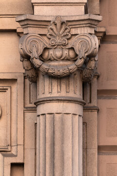 Elements of architectural decorations of buildings, columns and tops, gypsum molding, wall texture and stucco patterns. On the streets in Barcelona, public places.