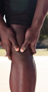 Fitness, hands or massage knee pain at park for muscle spasm, tissue overload or runner injury. Athlete, person or tendon discomfort outdoor for cardio accident, kneecap strain or patellar tendinitis