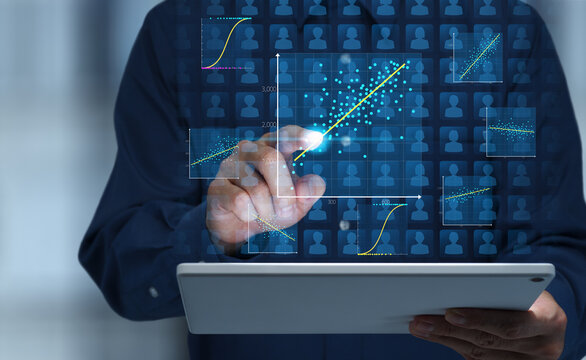 Customer data analytics. Regression analysis to identify factors influencing purchasing behavior and customer retention. Business analyst tapping graphs and marketing data on digital tablet.