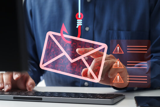 Phishing attack and scam email. Businessman falling victim to phishing. Spoofing and fraudulent messages arrives on desktop computer.