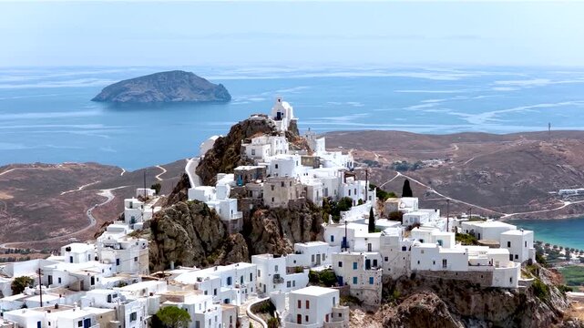 Panoramic aerial view of the main town Chora at Serifos island, Cyclades, Greece, situated on a mountain high up with whitewashed houses and blue domed churches