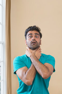 man suffocating from anxiety attack