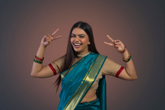 young woman dancing in saree