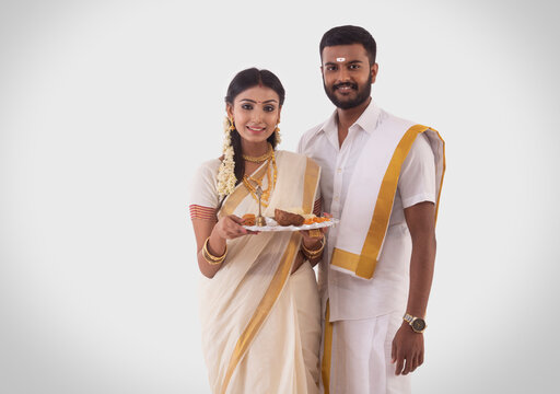 portrait of a south indian couple celebrating onam