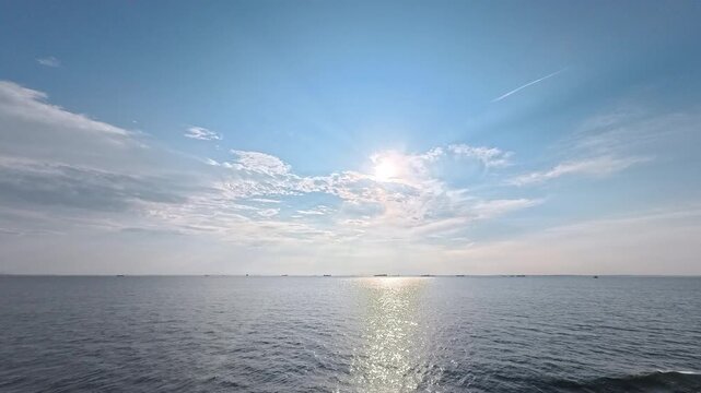 Radiant light texture and ocean background footage featuring contrail and clouds for visual effects