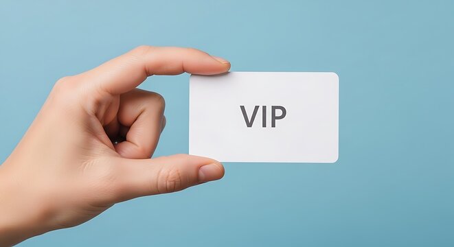 Hand holding white card with "VIP" on it against a blue background