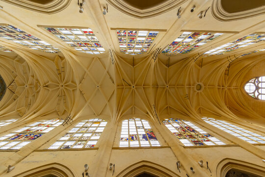 Ornate vaulted ceiling and stained glass in Sezanne church