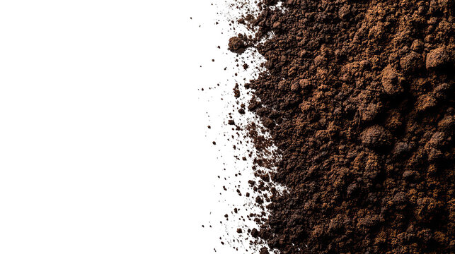 Texture detail of a granular, dark brown substance meeting a stark black void