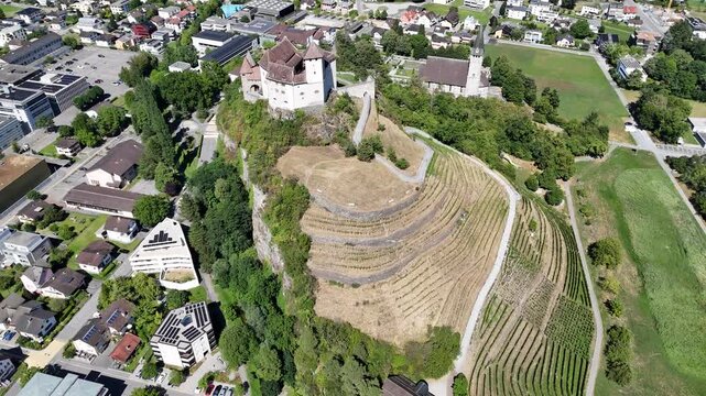 Aerial view of Gutenberg Castle in Balzers, Liechtenstein, surrounded by the Rhine Valley and Alpine landscape