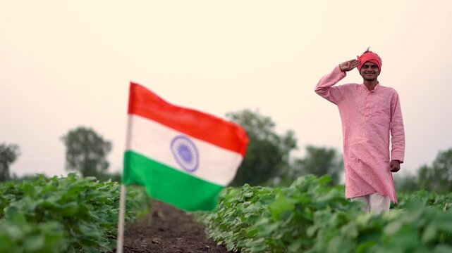 Indian farmer saluting national tricolor flag at agriculture field 