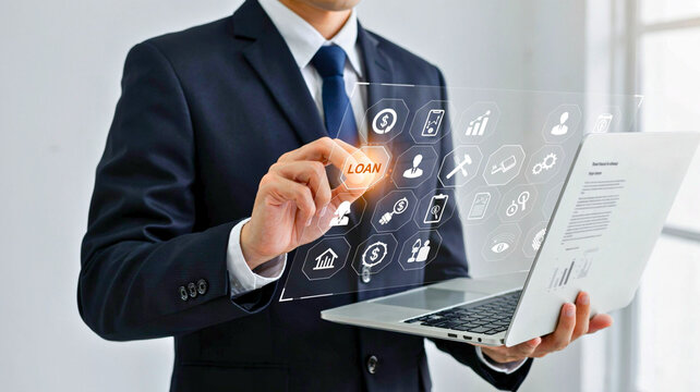 Businessman holding laptop and touching digital screen with loan icon, concept of financial technology, banking, and online services