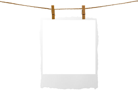 Blank photo frame hanging on a rope with a wooden clothespin. Isolated transparent PNG mockup.