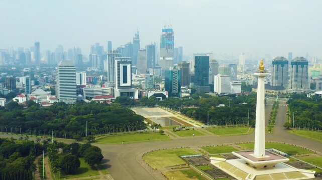 Aerial View of National Monument Monas, Merdeka Square, and Downtown Jakarta Skyline