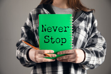 Fototapeta premium Minimalist Motivational Poster with Never Stop