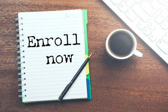 Enroll now text on a white paper
