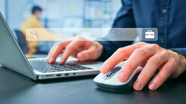Professional Working at Office Desk Using Laptop and Computer Mouse for Online Career Job Search and Employment Research
