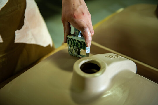 Workers engraved a stamp on the bottom of the sink.