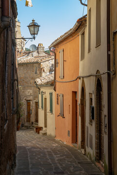 Navigating narrow street in historic Sorano, Tuscany, Italy