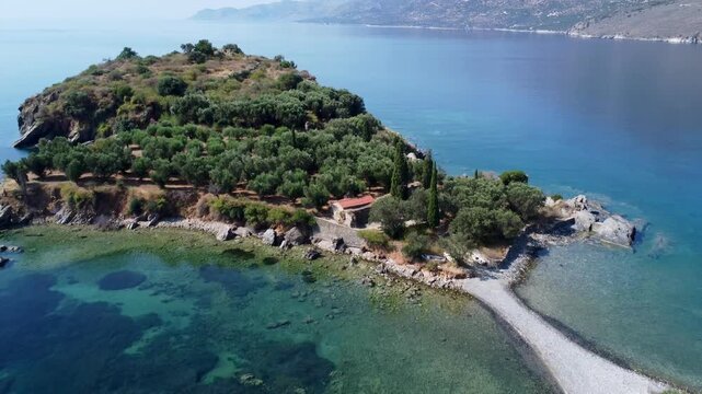 Drone footage of Paralia Dipli in Mani, Greece, showcases secluded turquoise coves, rocky shoreline, and pristine Mediterranean coastal scenery.