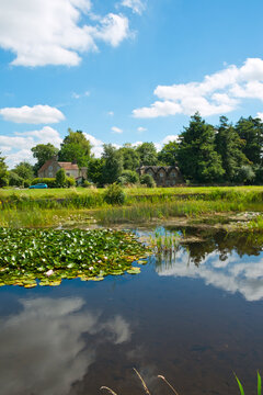 Idyllic homes around the picturesque village green and ponds at Frampton on Severn, Gloucestershire, UK.