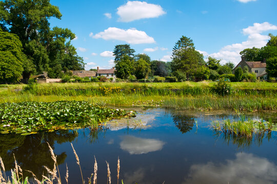 Idyllic homes around the picturesque village green and ponds at Frampton on Severn, Gloucestershire, UK.