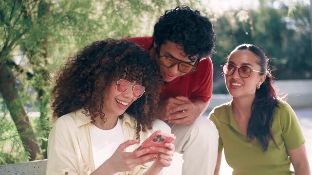 Video of three friends taking selfie with smartphone while sitting on the street
