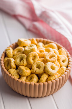 Italian Taralli Snack Rings In Ceramic Bowl With Olive Oil And Pink Checkered Cloth