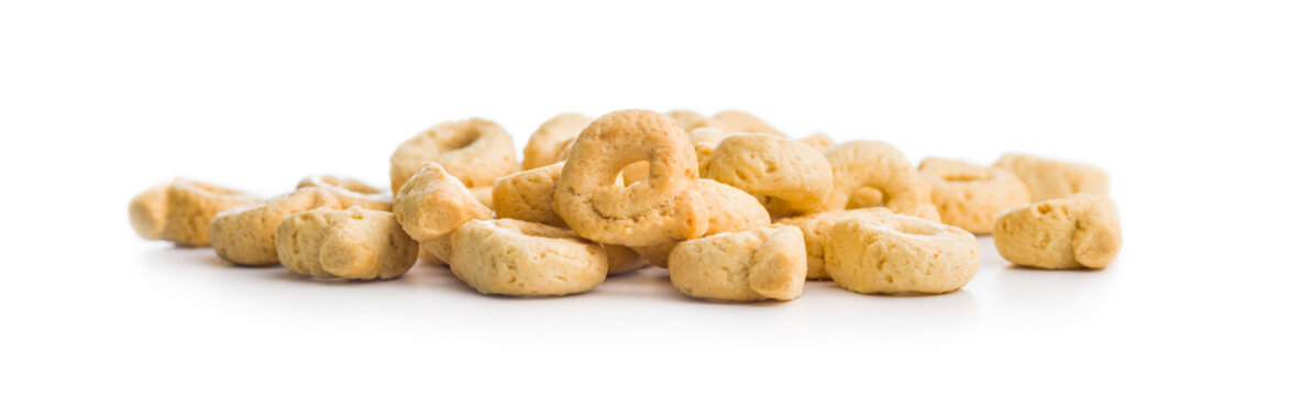 Pile of Golden Italian Taralli Snack Crackers on White Background Close-Up Food Still Life