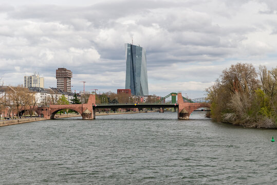 FRANKFURT AM MAIN, GERMANY - APRIL 4, 2026: Cityscape panorama looking over the Main river towards the Ignatz-Bubis-Bruecke bridge and the European Central Bank skyscraper