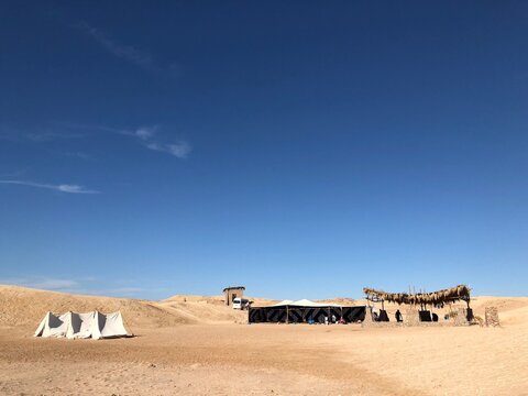 Bedouin campsite with shade tents on the desert coast of Ras Mohamed near Sharm El Sheikh
