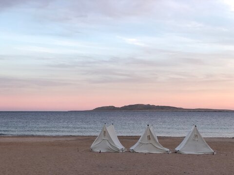 Bedouin campsite with shade tents on the desert coast of Ras Mohamed near Sharm El Sheikh
