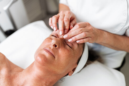 Reassuring skincare procedure performed by a specialist, focusing on relaxation, anti-aging therapy, and wellness care.
