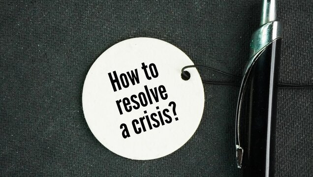 Pen and paper tag with question words How to resolve a crisis? successfully find a solution to a sudden, dangerous, or unstable event, bringing a situation of high stress