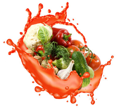 Fresh vegetables splash in red liquid creating a dynamic scene in the kitchen
