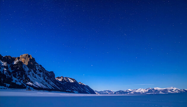 Snowy Mountain Landscape Under Starry Sky

