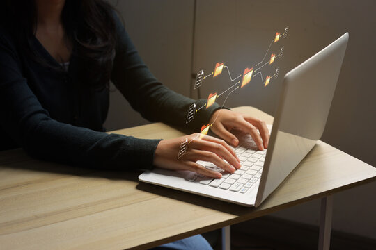 High Angle View Of Worker Typing On Laptop Keyboard At Desk For Data Management