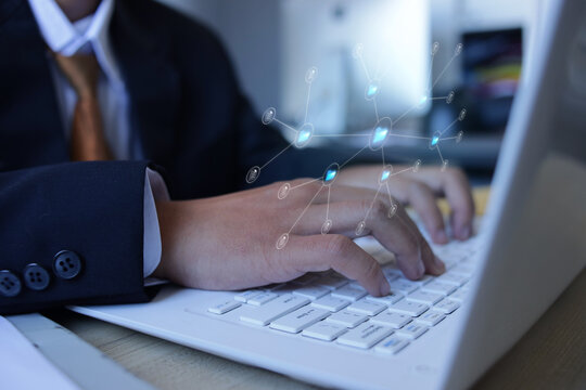 Close Up Of Businessman Using Laptop Displaying Data Storage Management