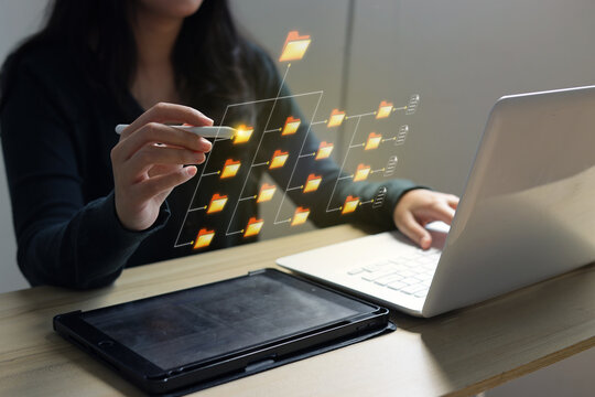 High Angle Of Woman Managing Documents And Data Using Stylus Pen With Laptop And Digital Tablet On Desk