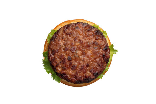 Grilled burger patty on green lettuce leaf