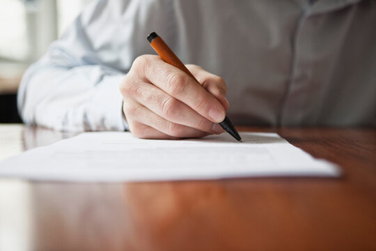 Man signing document