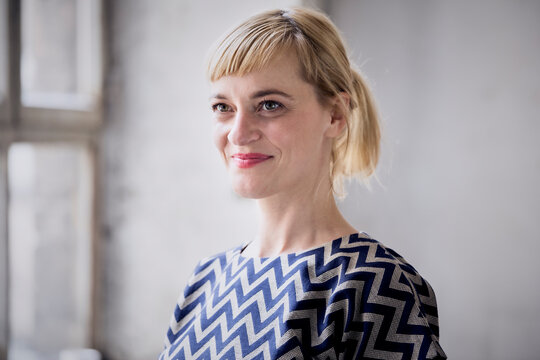 Portrait of happy blond businesswoman