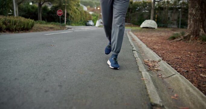 Fitness, legs and athlete running in road for pace training, endurance challenge and morning cardio. Active, person and jog in neighborhood for sports exercise, physical activity or wellness practice