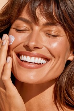 Sunlit portrait of smiling woman applying sunscreen for radiant skincare and sun protection