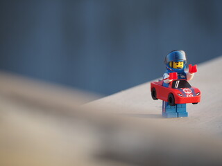 Fototapeta premium Indonesia - July 16, 2019 : Mini toy at outdoor with blurred background. Toy photography design concept.