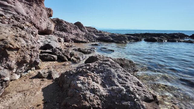 Rocky coastline and crystal clear waters on the Aegean Sea on the island of Thasos, Greece