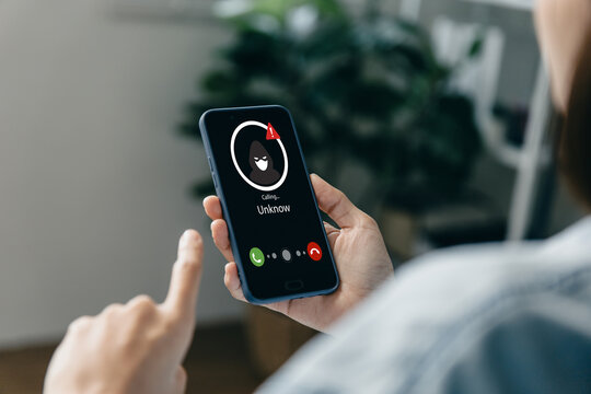 Unknown caller scam alert on smartphone