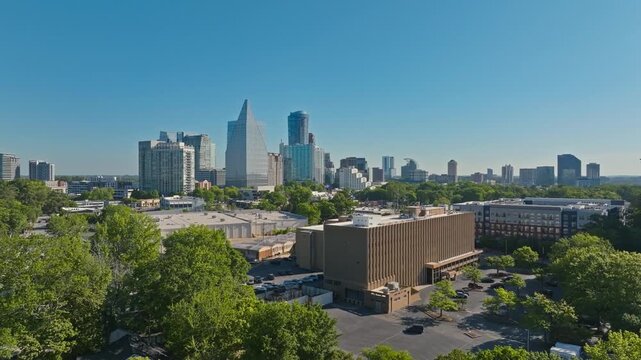 Aerial of Buckhead upscale neighbourhood, Peachtree road and Piedmont road commercial and residential highrise buildings surrounded by green trees, Atlanta, Georgia