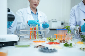 Fototapeta premium Team scientists research natural skincare products in a modern laboratory, testing formulas, analyzing ingredients, and driving cosmetic innovation and development.