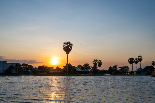 Sunset over floating Bugis fishermen village, Lake Tempe, Sulawesi, Indonesia